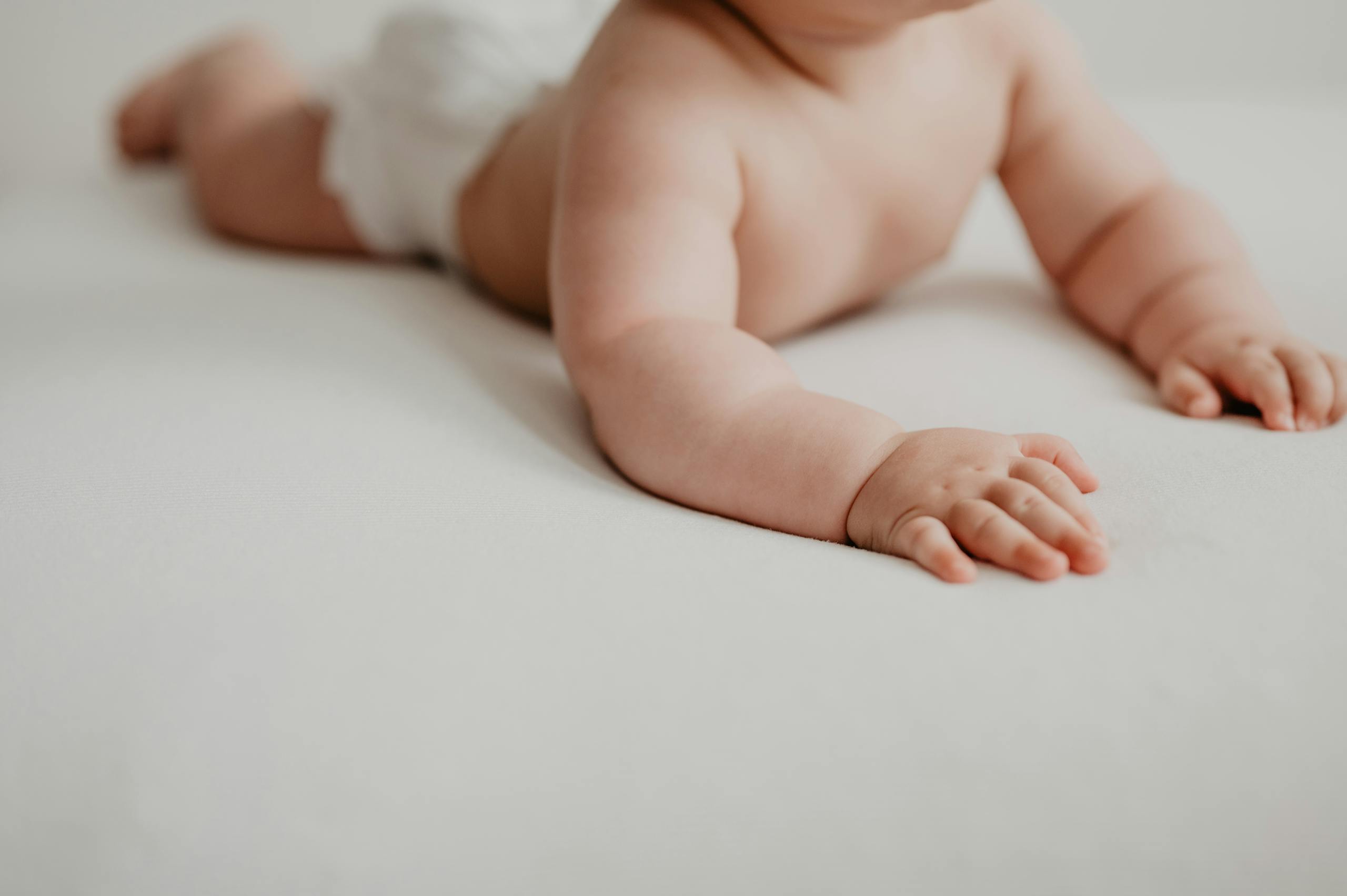 Close up of baby doing tummy time after review with Williamstown osteopath
